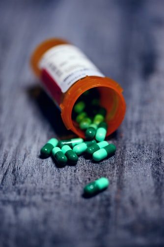 Capsules spilling out from a prescription bottle